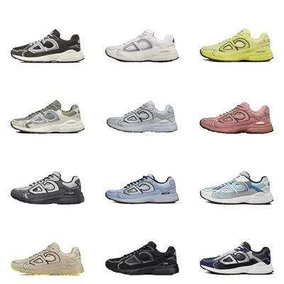 Twelve pairs of low-top trainers laid out in a grid on white, in grey, navy, cream and pink
