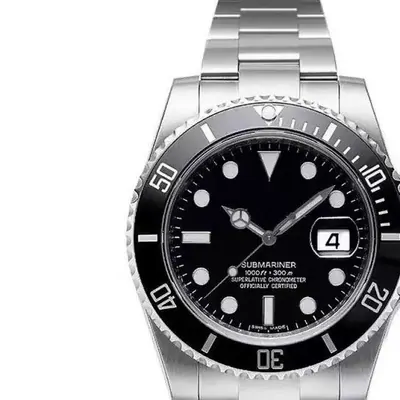 A steel dive watch with a black dial and rotating bezel shot close up on white